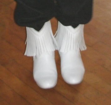cowboy boots kicking their heels up